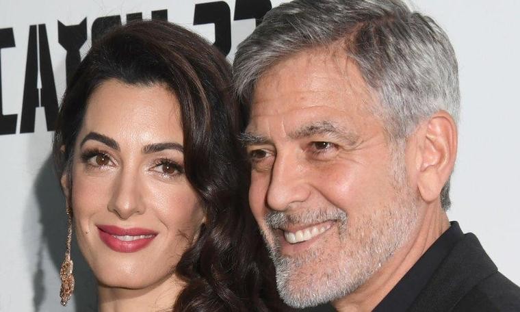 George ve Amal Clooney, vakıflarına destek kampanyasında bir çifti villalarında ağırlayacak