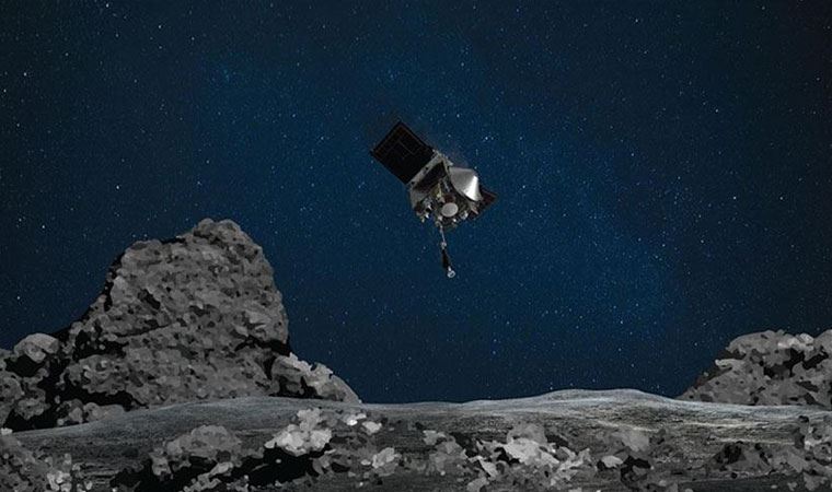 NASA'nın uzay aracı topladığı gök taşı örneklerini dünyaya getirecek kapsüle yerleştirdi