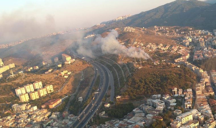 İzmir'de korkutan anlar: Evde çıkan yangın makilik alana sıçradı