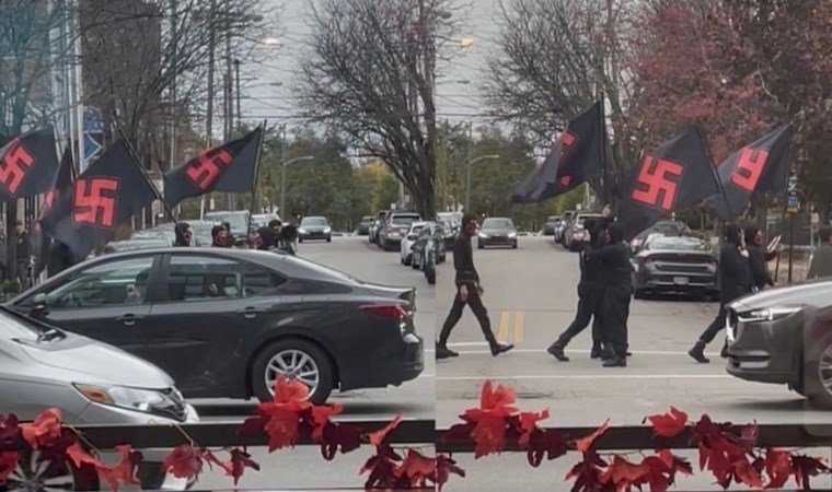 Nazi bayraklı maskeli adamlar sokakta gezerken görüntülendi