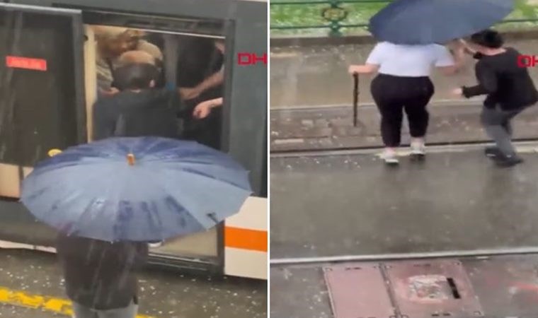Sosyal medyada gündem oldu Vatman ıslanmasın diye şemsiye tuttu