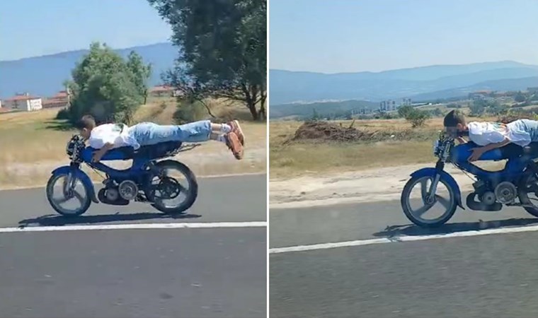 Trafikte tehlikeli anlar: Motosikleti üzerine yatarak kullandı!