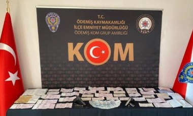 İzmir'de tefecilik yaptığı şüphesiyle 2 kişi gözaltına alındı