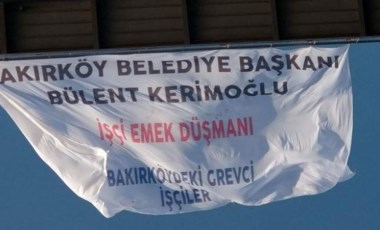 Grevde olan Bakırköy Belediyesi işçileri 15 Temmuz Şehitler Köprüsü'ne pankart astı