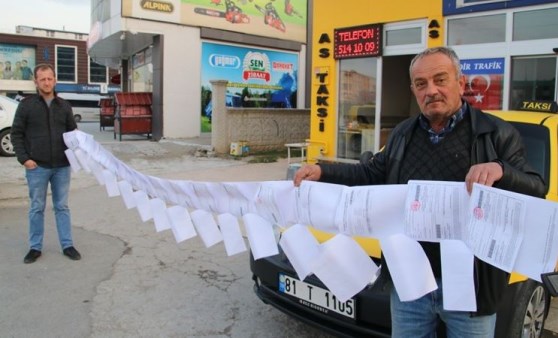 Yediği trafik cezaları 6 metreyi buldu